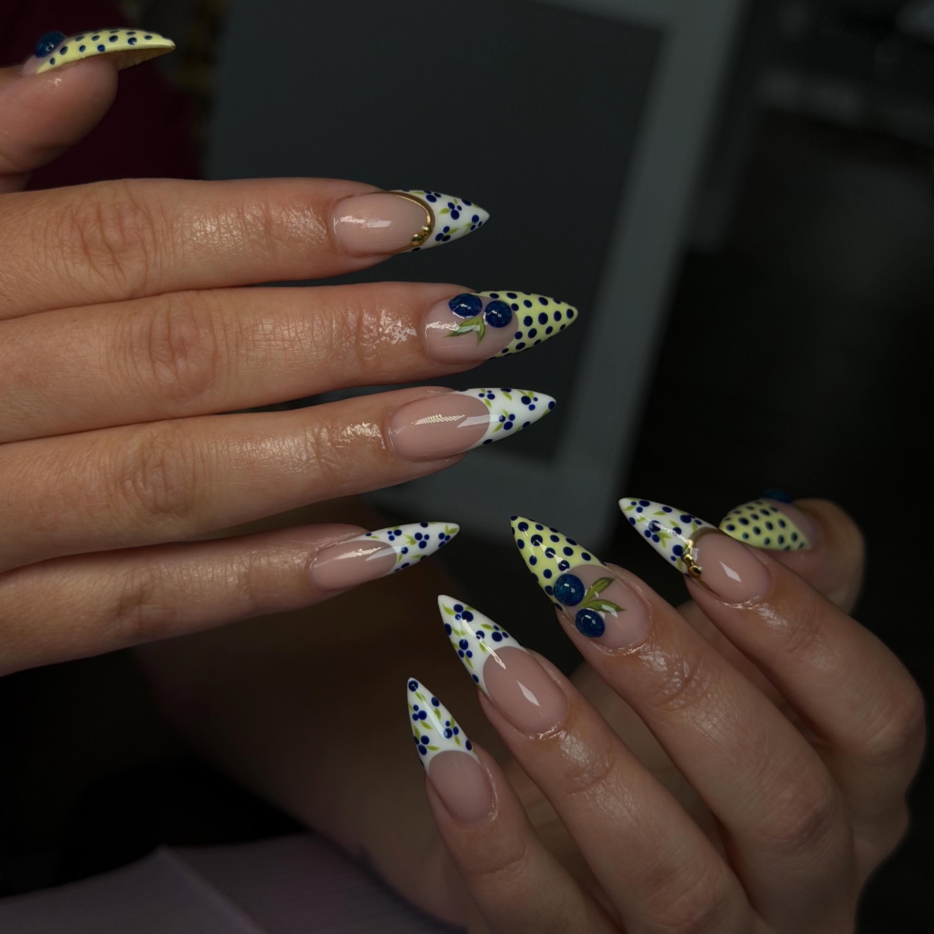 Yellow and white stiletto nails with blueberry and dot art by Rita