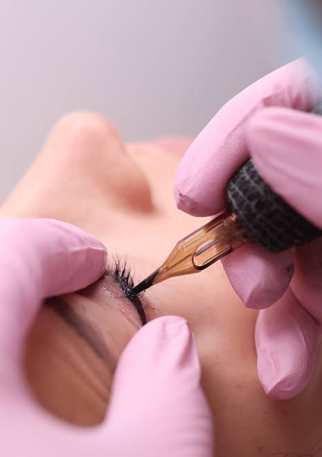 Semi-permanent eyeliner being applied
