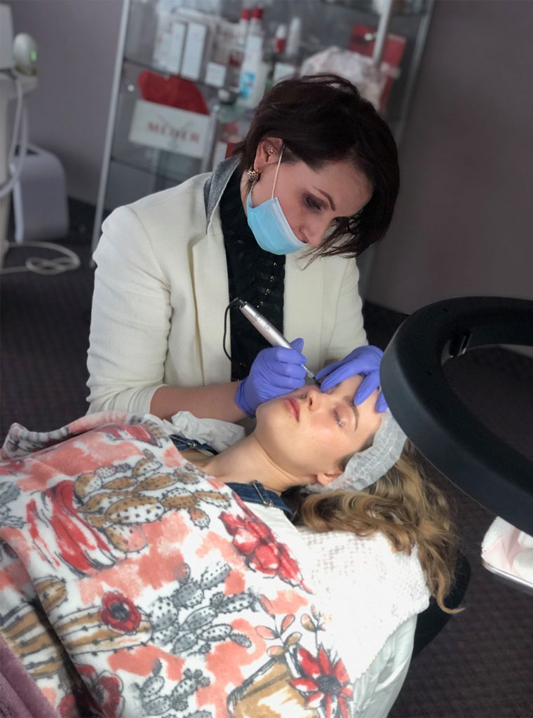 Lana performing microblading treatment